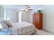 Bedroom with ceiling fan, wardrobe cabinet and neutral bedding at 1272 Mount Logan Dr, Apopka, FL 32712