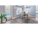 Bright dining area features vinyl floors and view to fenced pool at 1272 Mount Logan Dr, Apopka, FL 32712