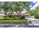 Charming single-story home featuring a well-manicured lawn, mature trees, and a two-car garage at 1272 Mount Logan Dr, Apopka, FL 32712