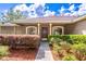 Inviting home exterior with a well-manicured front yard and charming curb appeal at 1272 Mount Logan Dr, Apopka, FL 32712
