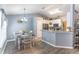 Cozy kitchen and dining area with modern lighting, countertops, and stainless steel appliances at 1272 Mount Logan Dr, Apopka, FL 32712