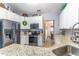 Updated kitchen featuring granite countertops, stainless steel appliances, and ample cabinet space at 1272 Mount Logan Dr, Apopka, FL 32712