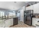 Contemporary kitchen with granite counters, stainless appliances, and hardwood floors, a chef's dream at 1272 Mount Logan Dr, Apopka, FL 32712