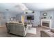 Spacious living room features luxury vinyl floors and cozy fireplace at 1272 Mount Logan Dr, Apopka, FL 32712