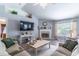 Living room showcases luxury vinyl floors and cozy fireplace with mantle at 1272 Mount Logan Dr, Apopka, FL 32712