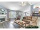 Open living room boasts a fireplace, vinyl floors, and neutral paint at 1272 Mount Logan Dr, Apopka, FL 32712