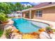 Inviting backyard pool with covered patio, seating area, and well-maintained landscaping at 1272 Mount Logan Dr, Apopka, FL 32712