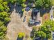 Aerial view showcases the property's layout, including the pool, backyard features, and surrounding wooded area at 133 Orange Ridge Dr, Longwood, FL 32779