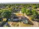 Charming single-Gathering home with a screened pool, surrounded by a well-kept yard and mature trees at 133 Orange Ridge Dr, Longwood, FL 32779