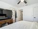 Well lit bedroom featuring television, drawers and access to other rooms at 133 Orange Ridge Dr, Longwood, FL 32779