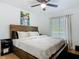 Inviting bedroom featuring a large bed, soft lighting, and a window with natural light at 133 Orange Ridge Dr, Longwood, FL 32779