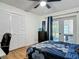 Charming bedroom featuring a closet, a dresser with an Eiffel Tower picture, and glass doors at 133 Orange Ridge Dr, Longwood, FL 32779