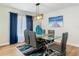 Dining area with modern chandelier and furniture set on laminate wood flooring at 133 Orange Ridge Dr, Longwood, FL 32779