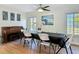 Well-lit dining area with a piano and modern artwork, creating an inviting atmosphere at 133 Orange Ridge Dr, Longwood, FL 32779