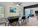 Bright dining room featuring large windows, artwork, and easy access to living area at 133 Orange Ridge Dr, Longwood, FL 32779