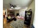 Large living room includes tile floors, ceiling fan, natural light and access to kitchen and bath at 133 Orange Ridge Dr, Longwood, FL 32779