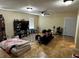 Expansive living room features neutral walls, tile floors, ceiling fan and checkered rug at 133 Orange Ridge Dr, Longwood, FL 32779