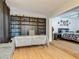 Shelving unit displays an array of mugs, with a desk in front, plus a glimpse into the main bedroom at 133 Orange Ridge Dr, Longwood, FL 32779