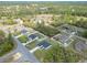 An elevated view depicts a suburban community with modern homes, green spaces, and a relaxed atmosphere at 16121 Sw 37Th Terrace Rd, Ocala, FL 34473