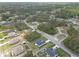 An aerial shot displays a charming neighborhood with a blend of modern homes and natural wooded areas at 16121 Sw 37Th Terrace Rd, Ocala, FL 34473