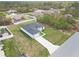 Overhead angle highlights a modern home with a pristine driveway on a grassy lot in a quiet neighborhood at 16121 Sw 37Th Terrace Rd, Ocala, FL 34473