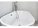 Close-up of a modern, freestanding bathtub with sleek fixtures at 16121 Sw 37Th Terrace Rd, Ocala, FL 34473