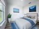 Well-lit bedroom with calming decor and a large window at 16121 Sw 37Th Terrace Rd, Ocala, FL 34473