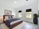 Comfortable bedroom with wood floors, natural light, and a neutral color palette at 16121 Sw 37Th Terrace Rd, Ocala, FL 34473