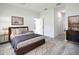 Bedroom features wood floors, ample natural light, and a cozy rug at 16121 Sw 37Th Terrace Rd, Ocala, FL 34473