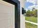 Close up of a house number on a newly constructed home with a black outdoor light fixture at 16121 Sw 37Th Terrace Rd, Ocala, FL 34473