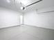 Clean, bright two-car garage with access door to the home's interior at 16121 Sw 37Th Terrace Rd, Ocala, FL 34473