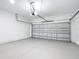Spacious two-car garage with block walls and smooth, painted concrete floors at 16121 Sw 37Th Terrace Rd, Ocala, FL 34473