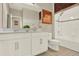 Bright bathroom featuring double sinks, tiled shower and a separate bathtub for a relaxing experience at 17055 Wynford Ln, Winter Garden, FL 34787