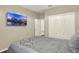 Comfortable bedroom with large TV and closet storage at 17055 Wynford Ln, Winter Garden, FL 34787