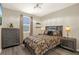 Comfortable bedroom with modern furniture, stylish decor, and ample natural light, with laminate flooring at 17055 Wynford Ln, Winter Garden, FL 34787