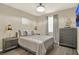 Cozy bedroom with laminate flooring, soft lighting, and neutral decor, perfect for relaxation at 17055 Wynford Ln, Winter Garden, FL 34787