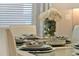 Formal dining room table setting with elegant decor and tableware at 17055 Wynford Ln, Winter Garden, FL 34787