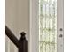 Close up of front door with decorative glass and sidelight at 17055 Wynford Ln, Winter Garden, FL 34787