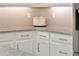 Elegant kitchen corner featuring granite countertops and white cabinets with sleek hardware at 17055 Wynford Ln, Winter Garden, FL 34787