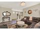 Living room featuring wood floors, comfortable seating, staircase and elegant decor at 17055 Wynford Ln, Winter Garden, FL 34787