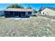 Spacious backyard showcasing a well-maintained lawn and fenced perimeter at 1795 Orange View Ct, Kissimmee, FL 34746