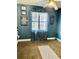 Bedroom featuring a window with curtains and posters of superheroes on the walls at 1795 Orange View Ct, Kissimmee, FL 34746