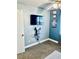 Bedroom with a TV mounted on the wall and a shelf with game consoles at 1795 Orange View Ct, Kissimmee, FL 34746