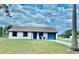 Charming single-story home with a well-maintained lawn and a blue-trimmed exterior at 1795 Orange View Ct, Kissimmee, FL 34746