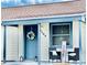 Inviting front porch with seating and decorative wreath, creating a welcoming entrance at 1795 Orange View Ct, Kissimmee, FL 34746