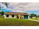Charming single-story home with a well-maintained lawn, driveway, and a cozy front porch at 1795 Orange View Ct, Kissimmee, FL 34746