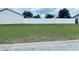 Spacious lot with lush green grass and a privacy fence, perfect for building your dream home at 1795 Orange View Ct, Kissimmee, FL 34746