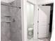 Bathroom featuring a tiled shower and a separate toilet room for added convenience at 1902 Presley Pl, Kissimmee, FL 34746