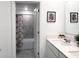 Bathroom with double sinks, quartz countertops, and a separate shower/tub area at 1902 Presley Pl, Kissimmee, FL 34746