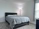 Cozy bedroom featuring a comfortable bed, soft lighting, and a view of the outdoors at 1902 Presley Pl, Kissimmee, FL 34746